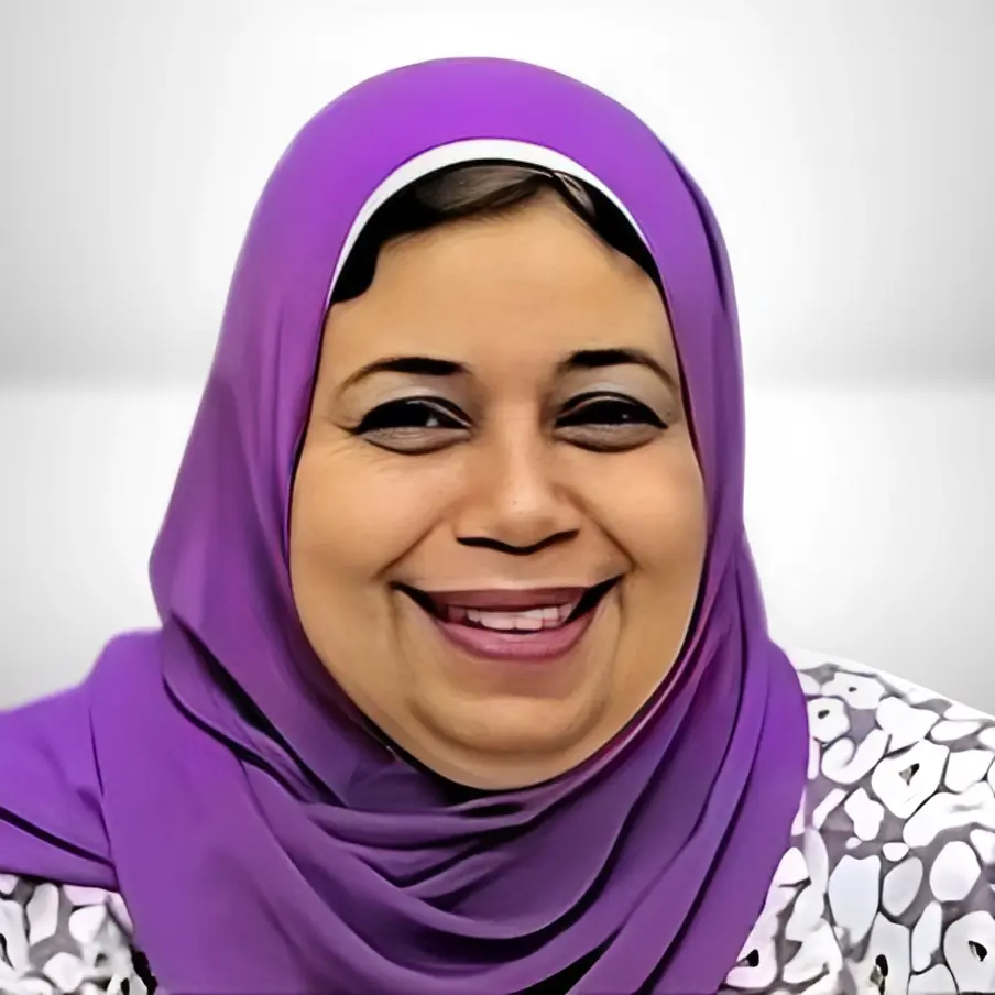 Person in a purple hijab with a patterned garment, with face obscured by a rectangle.